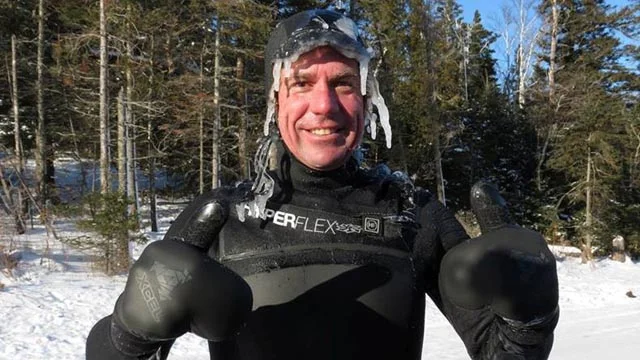 Burton Hathaway after surfing at Stoney Point on Lake Superior in sub-zero conditions. Photo by Erik Wilkie