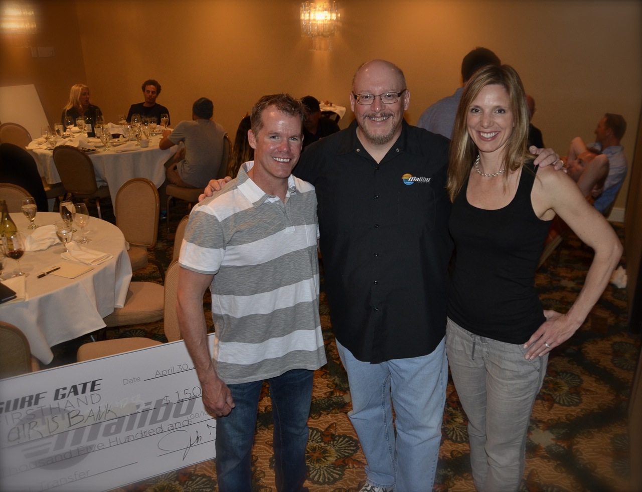 Stacia and husband, Chris Bank with CEO Jack Springer.