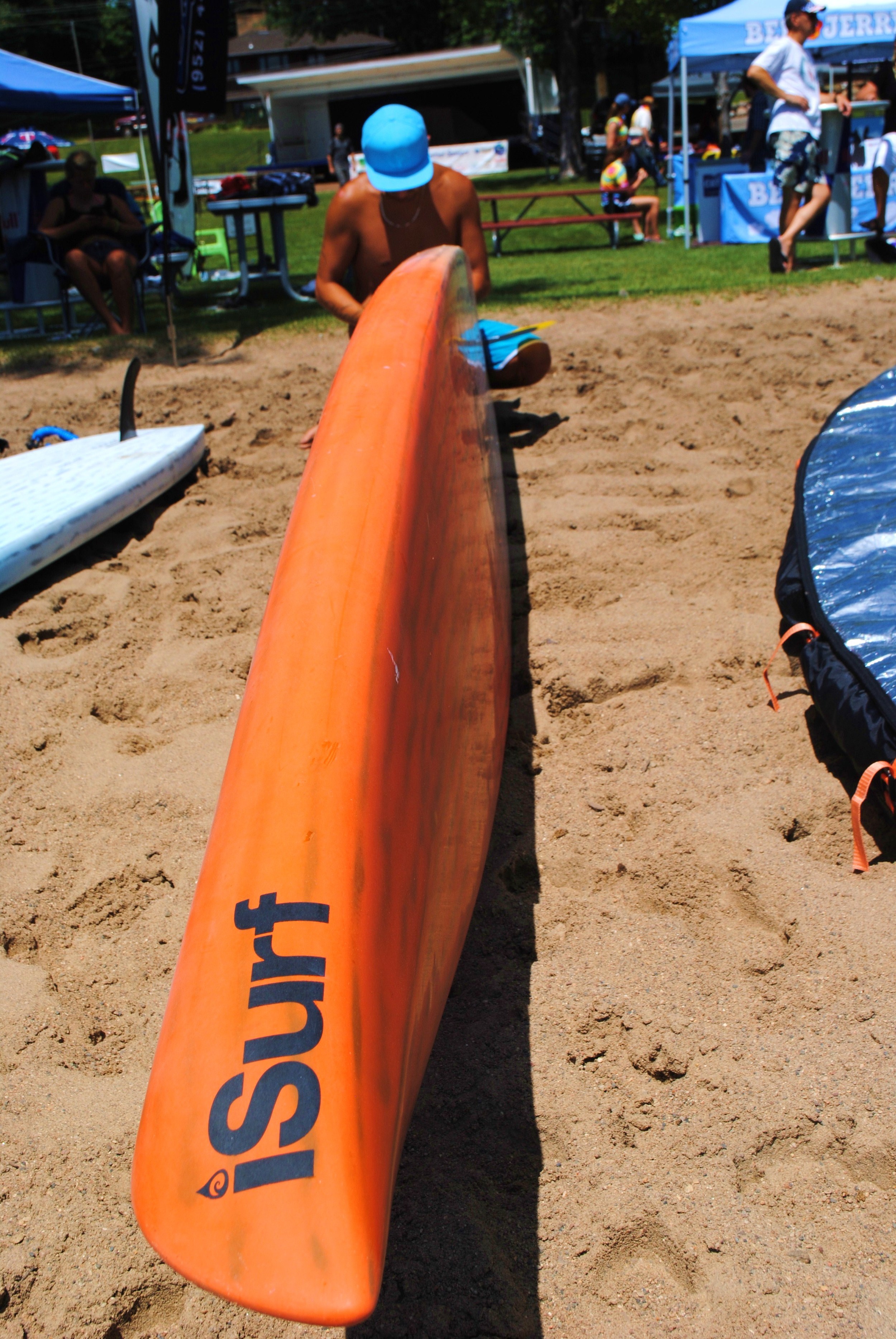 Alex Norman setting up some paddle boards for spectators to demo.