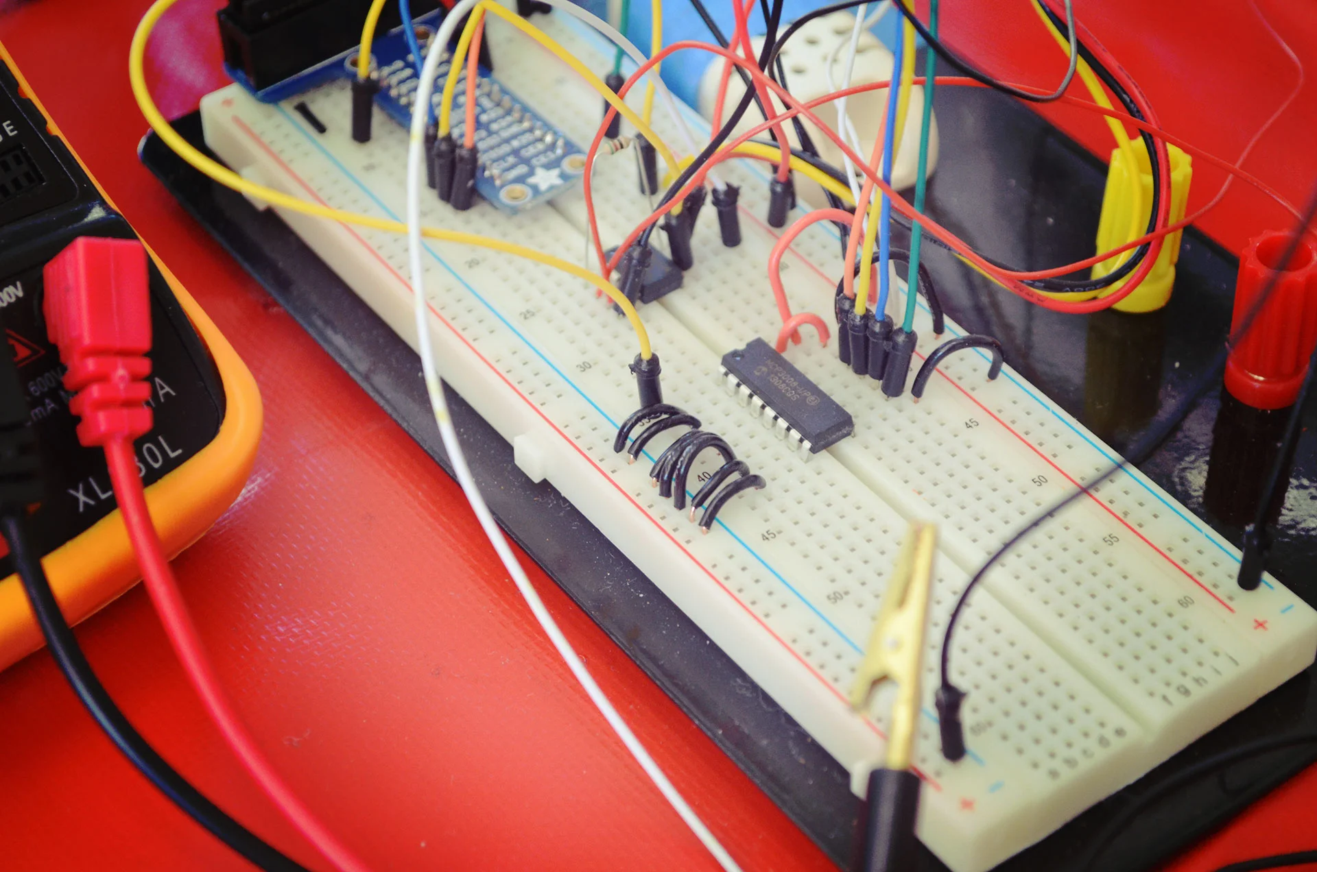 The weight-sensing circuit. Pictured is the Pi cobbler, the op-amp, and the A/D converter.