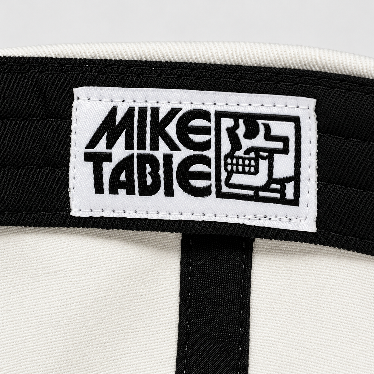 Mike Tabie collaboration label sewn into the black inner sweatband of the Work Horse cotton cap.
