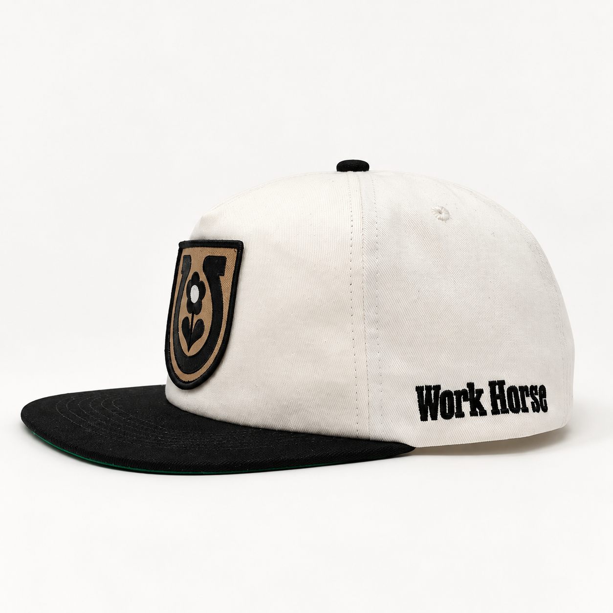 Side view of the Mike Tabie Work Horse cotton snapback showing the mid-profile shape, black brim, and Work Horse embroidery.