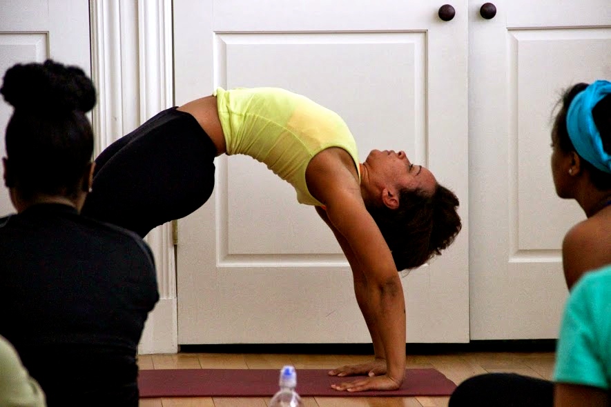 Performing Wheel pose during the workshop
