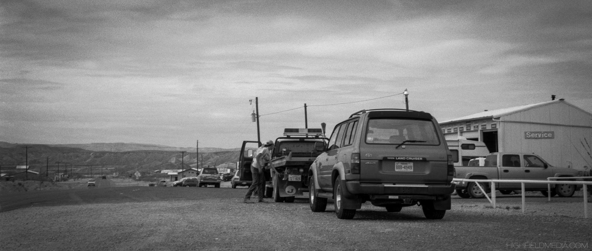 The Land Cruiser is unloaded from Beechie's Auto Service's flatbed truck. Beechie is one of the few tow operators who can rescue stranded vehicles from some of the more rugged areas of the park.