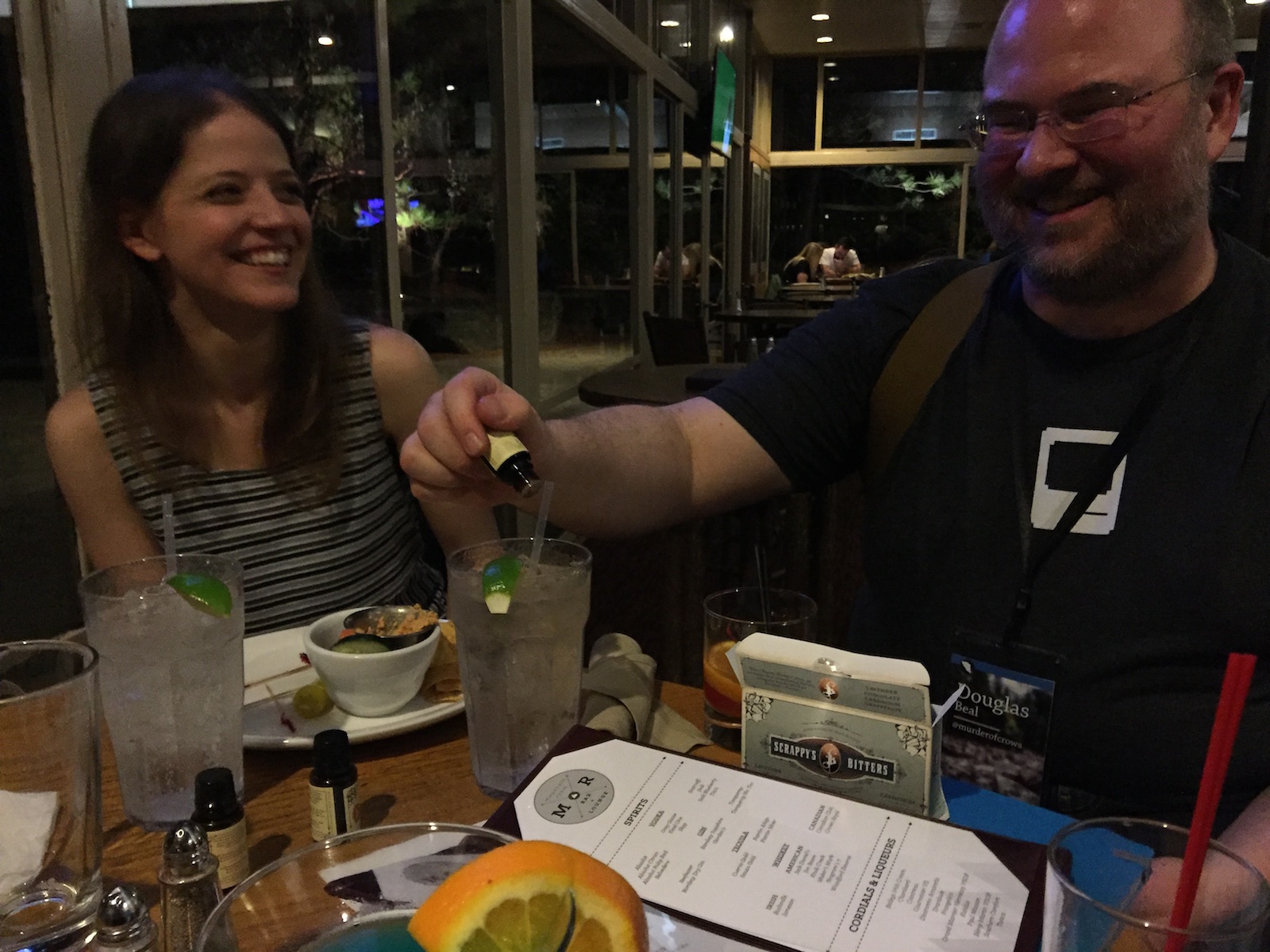 Laura Savino and Doug Beal mixing their own non-alcoholic drinks at the bar