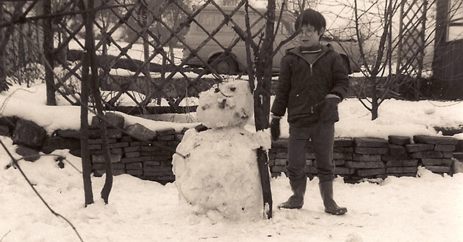 Jane and the snowman. In the back yard of her families Endon Village home around 1970