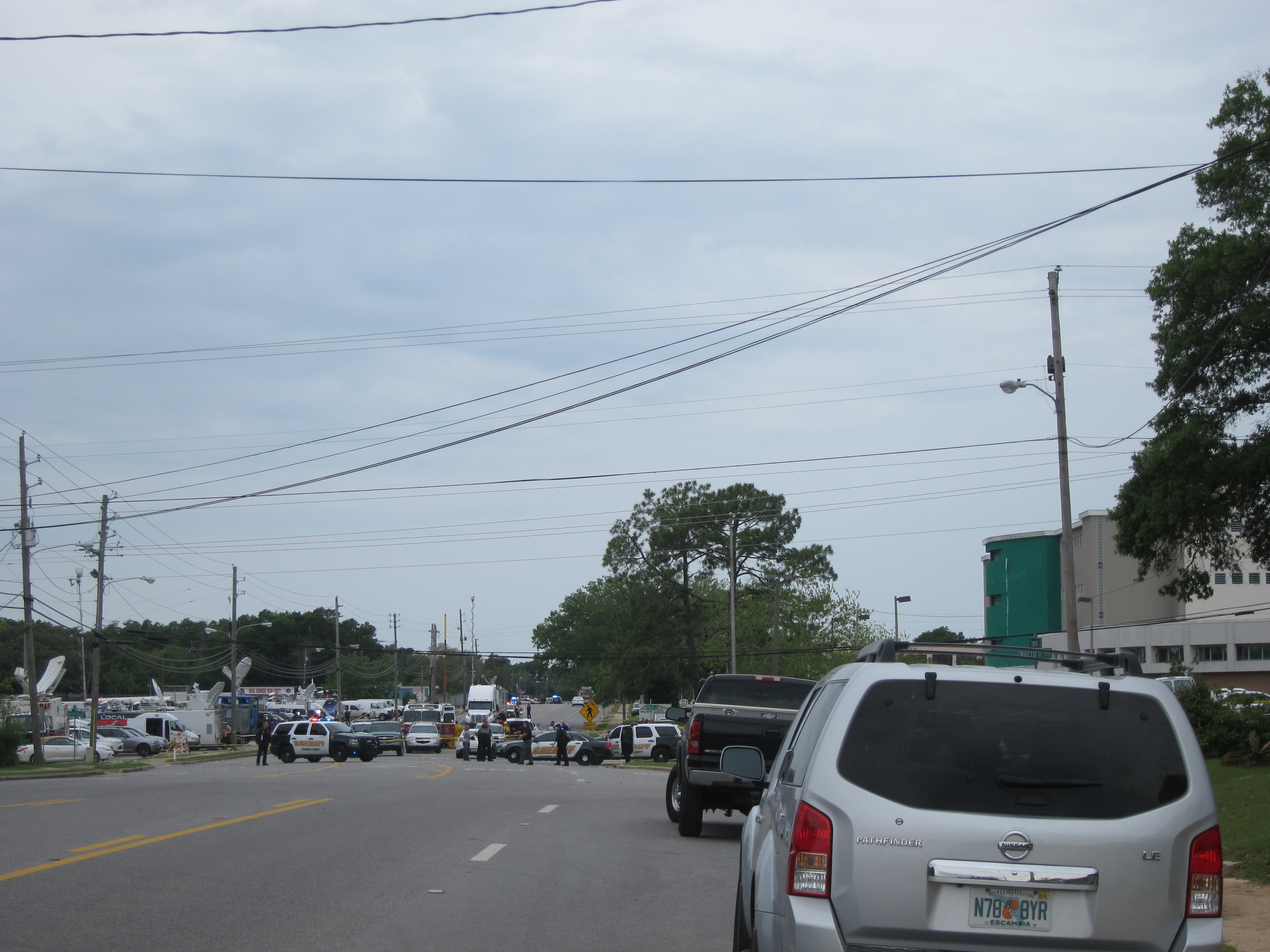 The police line at the Escambia County Jail the morning after an explosion killed two inmates, paralyzed a corrections officer and injured 184 people.