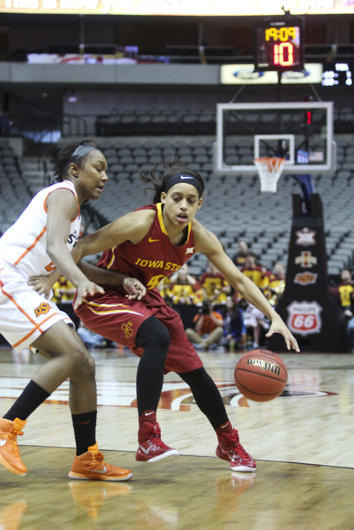 Senior guard Nikki Moody works her way around an opposing player against Oklahoma State in the third game of the 2015 Big 12 Championship in Dallas, Texas. The Cyclones fell to the Cowgirls 67-58. Photo by: Kelby Wingert/Iowa State Daily.