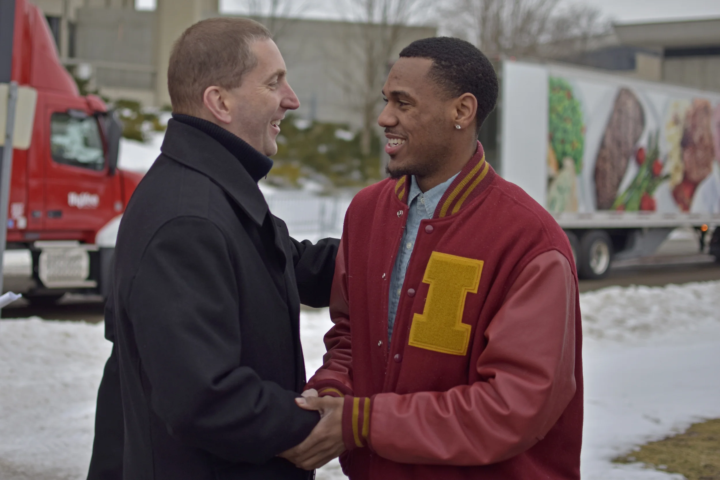 Iowa State Athletic Director Jamie Pollard and point guard Monte Morris talk outside of Hilton Coliseum on Thursday before 11 Hy-Vee trucks filled with drinking water depart for Flint, Michigan.&nbsp;RyanYoung/IowaStateDaily.&nbsp;