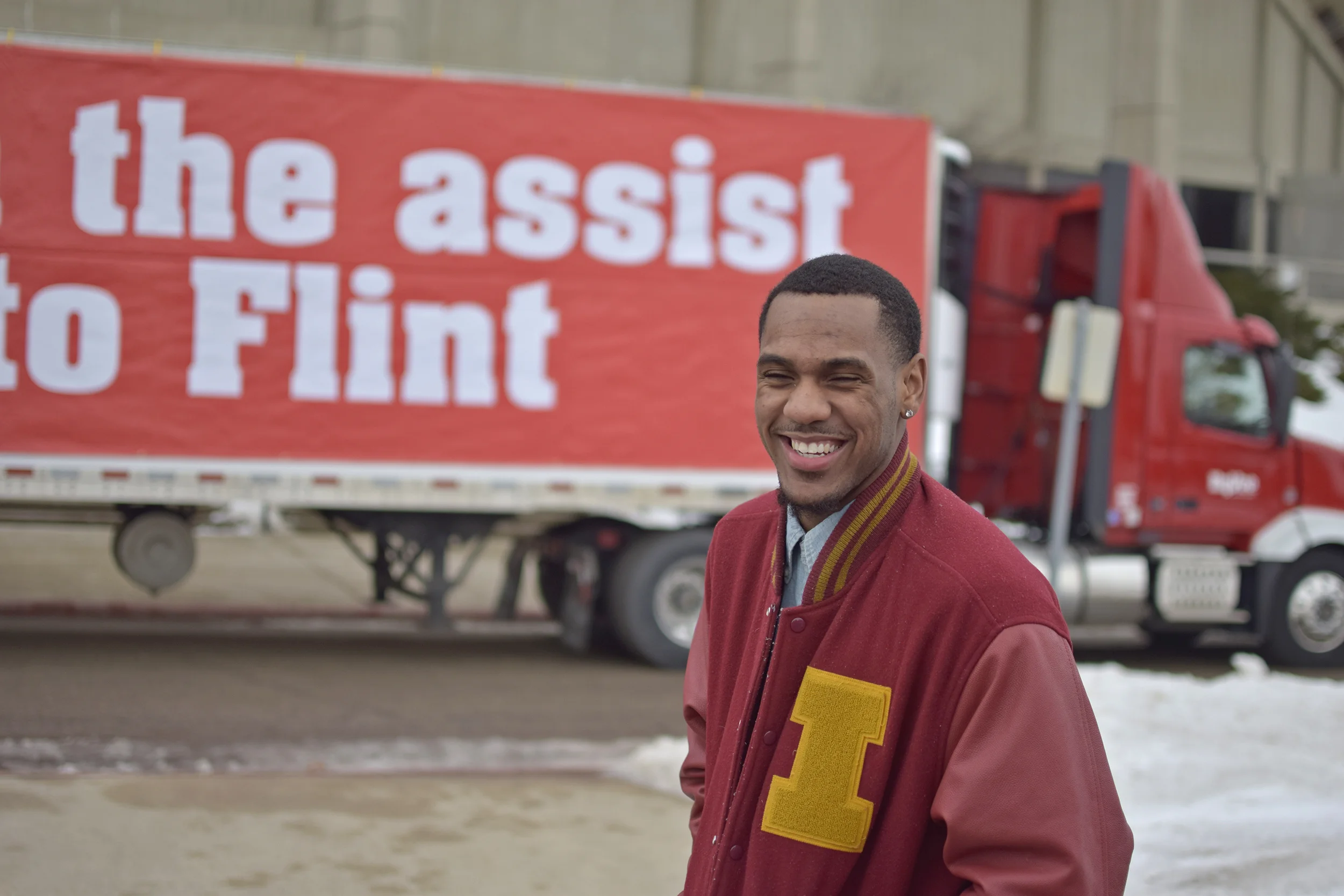 Iowa State point guard Monté Morris stands outside of Hilton Coliseum on Thursday with 11 trucks filled with drinking water. Hy-Vee helped Morris donate the water to Flint, Michigan, his hometown amid the city's water crisis.