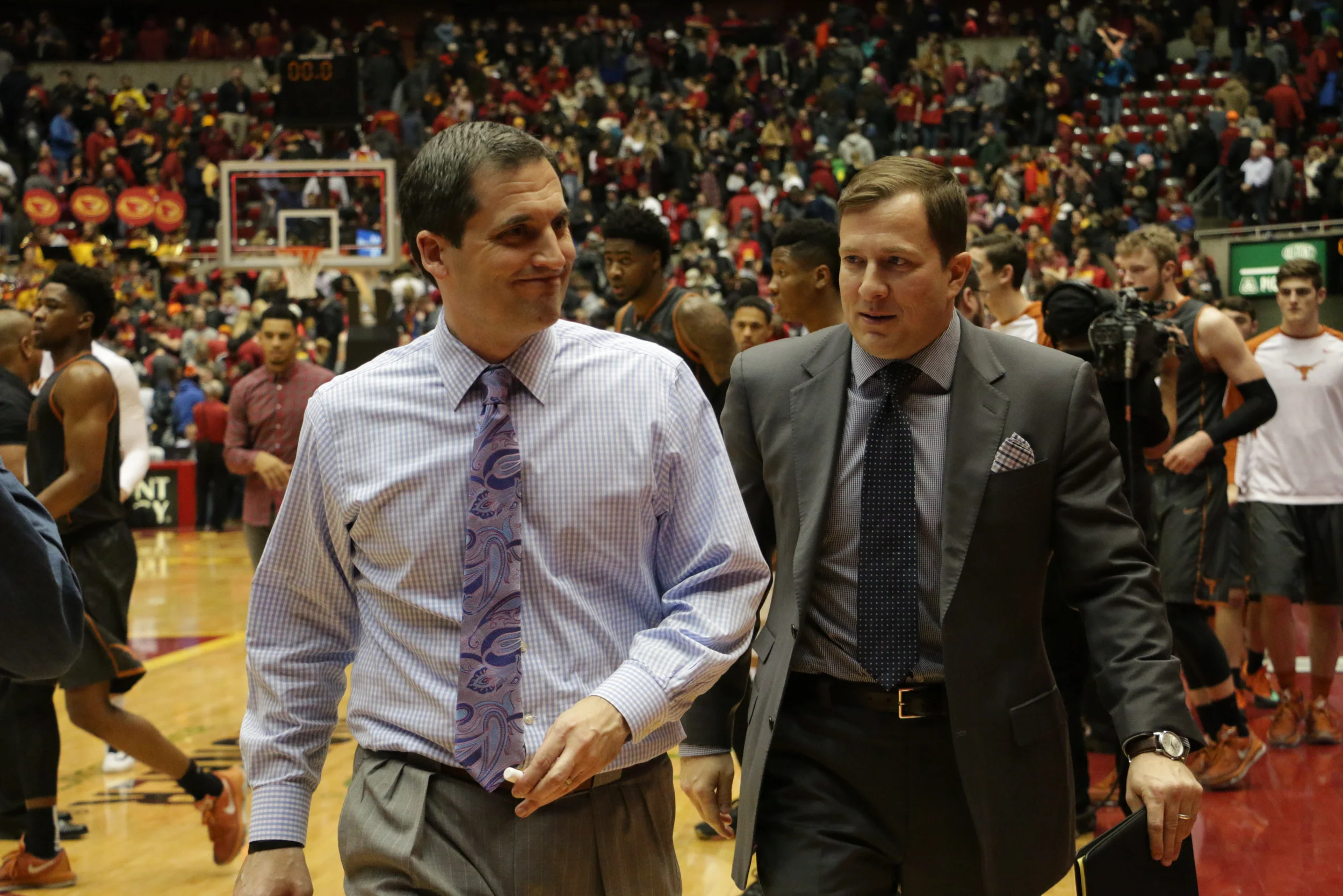 Iowa State coach Steve Prohm (left) walks to the tunnel with former-assistant coach T.J. Otzelberger after the Cyclones' game against Texas last season. Photo by Emily Blobaum/Iowa State Daily