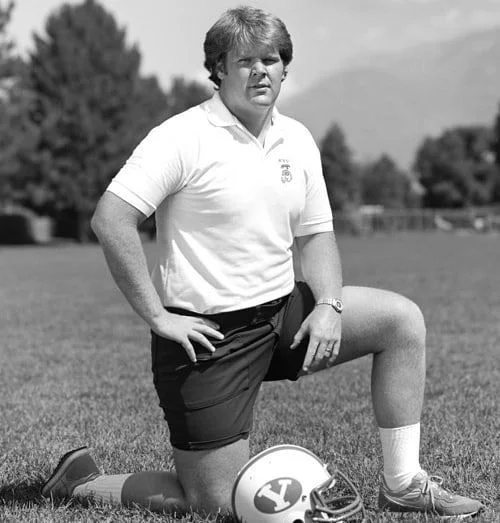 Andy Reid as a BYU assistant in 1982. He was the same size as a 12 year old in the Pass Punt and Kick competition. Look it up. We’re sparing you the picture.