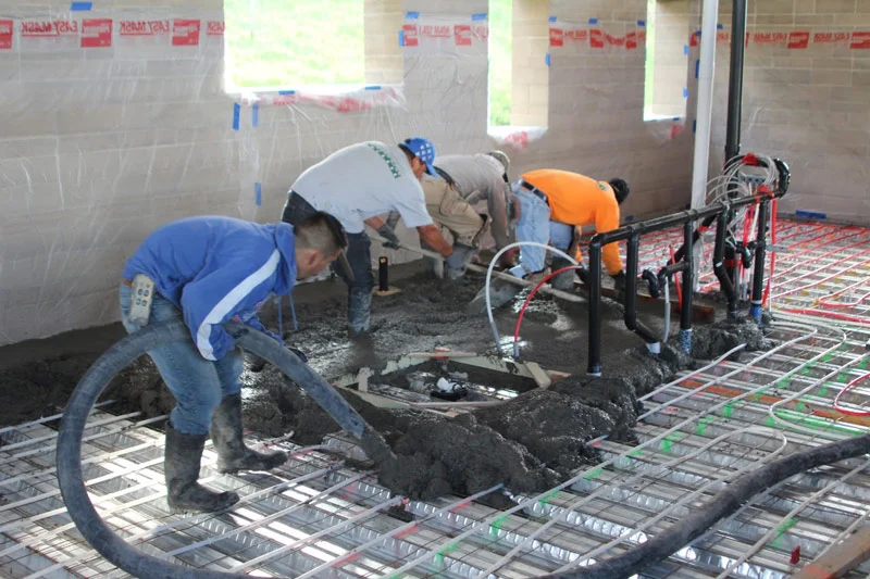Pouring the concrete floor in the upstairs bedrooms