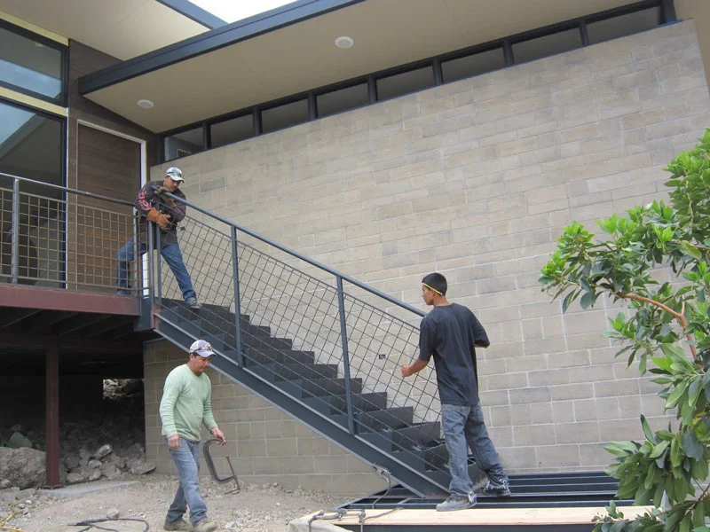 All Metal Fab's guys installing the stair railing