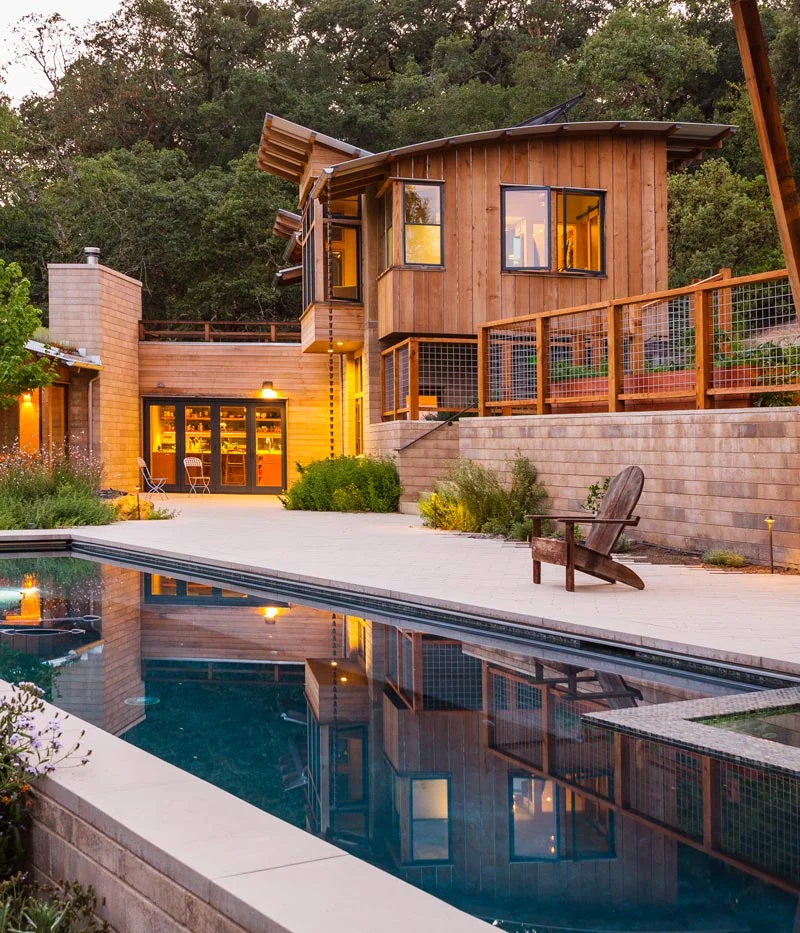 Arkin Tilt Architects' design for this sustainable private residence incorporates locally produced, low cement Watershed Block. The weight of the Watershed Block base, in some locations serving as retaining walls, creates both a structural and visual anchor to the lighter wood components. 
