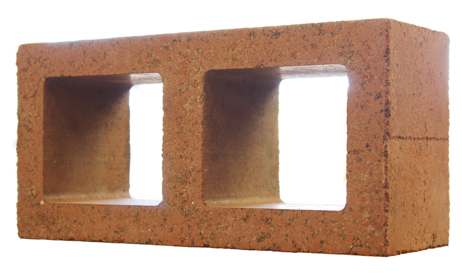 One of Watershed Materials’ first high-performance masonry blocks utilizing the geopolymerization of natural clay minerals. This geopolymer technology was developed during Watershed Materials’ Small Business Innovation Research grant supported by the National Science Foundation. The research team initially proposed to create a zero cement, 2,000 psi structural masonry block with this novel approach to geopolymer technology. With a year left to go in the research process, the team has surpassed that initial target by over 200% while demonstrating remarkable mechanical performances. The aesthetic gains over ordinary concrete block are a side benefit resulting from the character of local clays and aggregates. Variations in regional landscapes will produce masonry that is visually connected to local production.