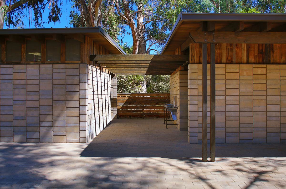 The new restroom building, nestled into the eucalyptus grove on Lasuen near Campus Drive, looks like it might have been there when Leland Stanford first bought the farm in 1885, except of course for the indoor plumbing. Recycled barn wood siding and Watershed Block structural walls capture a patina of well worn use. Image credit : © SkyHawk Photography - Brian Haux