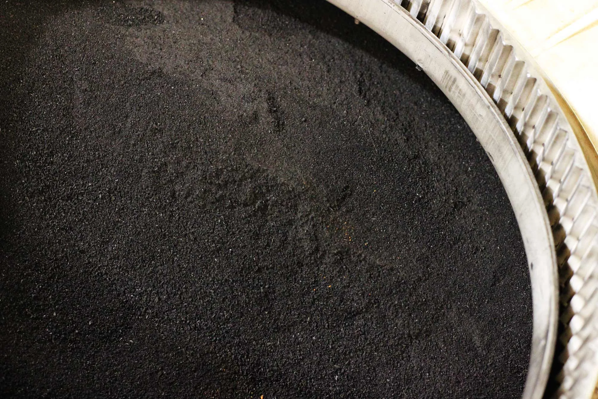 Utilizing locally-produced rice husk ash to supplement virgin cement in concrete and masonry building materials reduces their carbon footprint and makes productive use of an abundant waste-stream.