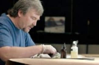 Joe Abbrescia Jr working in his art estoration studio in Montana.