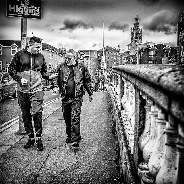 On Father Mathew Bridge... Having a good old chat as they passed me on the bridge, these two characters caught my eye and begged o be captured. Fuji X100s, 1/1000th sec, f/2, ISO 800, 23mm. #fujifilm #fujix100s #fujiblackandwhite #fujifilmblackandwhite #igersstreets #justgoshoot #bnwgreatshots #yngkillers #urbanandstreet #meistershots #fatalframes #streetshared #streetmagazine #instaireland #discoverdublin #dublindaily #spicollective #SPiBnW #streetphotography #streetshots