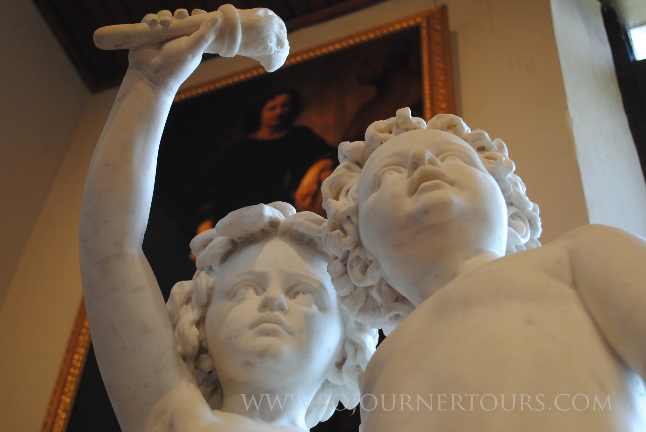 A portrait of Ney hangs above some of her sculpture work.