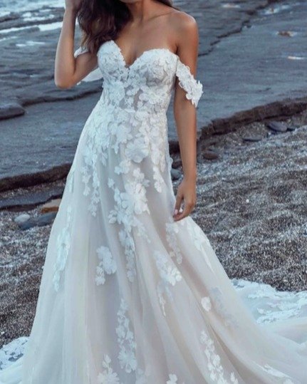 New Arrival!
We are delighted to present the Eddy K Wedding Gown, style VINCENZA DR2619. This A-Line gown offers a romantic and ethereal feel, crafted with delicate ivory lace and 3D appliqu&eacute;s layered over champagne and ivory tulle.

The unlin