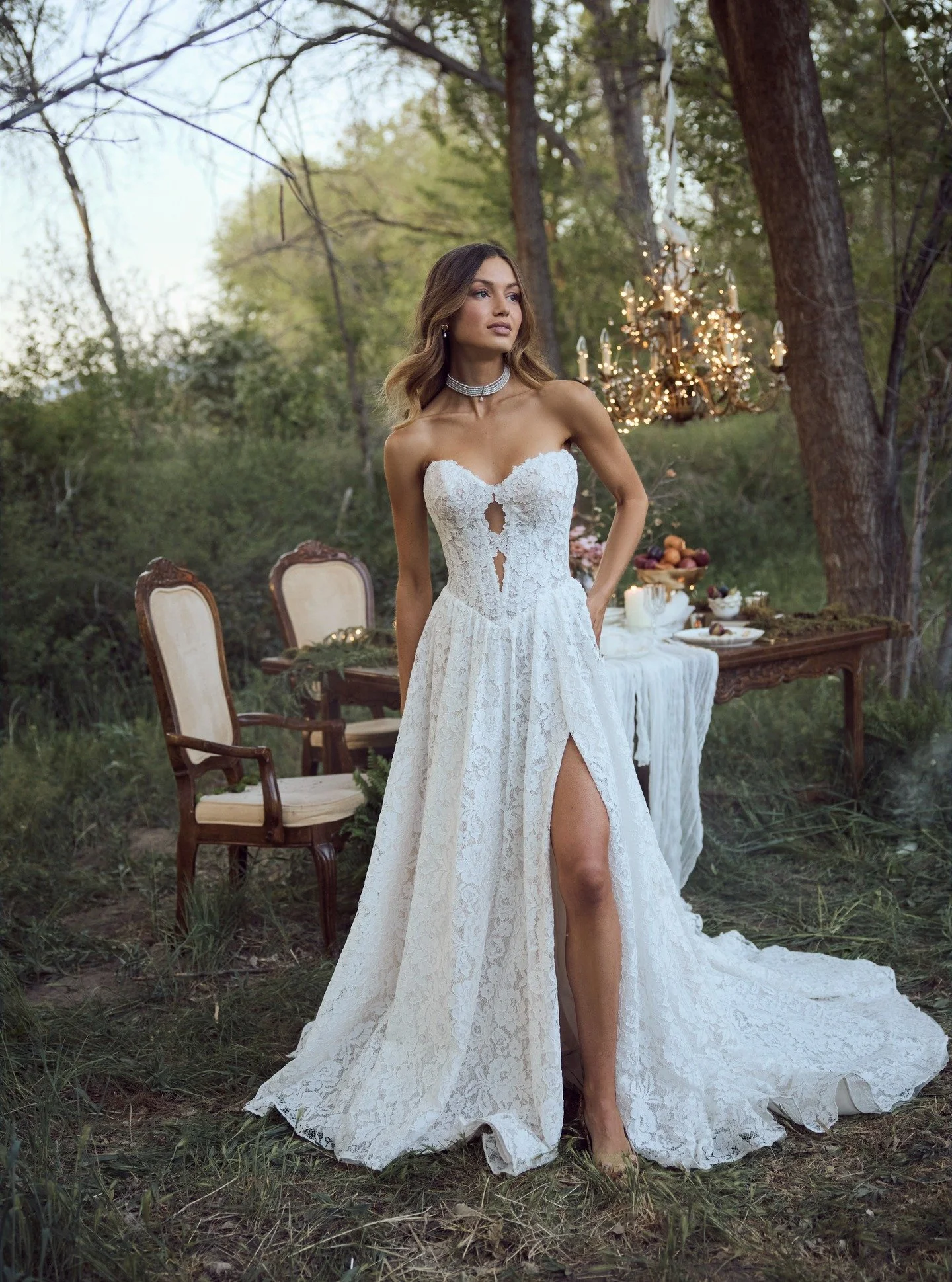 Meet Narelle: soft, effortlessly romantic, and undeniably captivating. This allover lace gown features subtly sultry cutouts that add just the right touch of allure. With its delicate details from every angle, this design strikes the perfect balance 