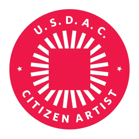 (Note: One need not be a legal citizen of the U.S. to be a Citizen Artist with the USDAC. Or an artist, for that matter!)