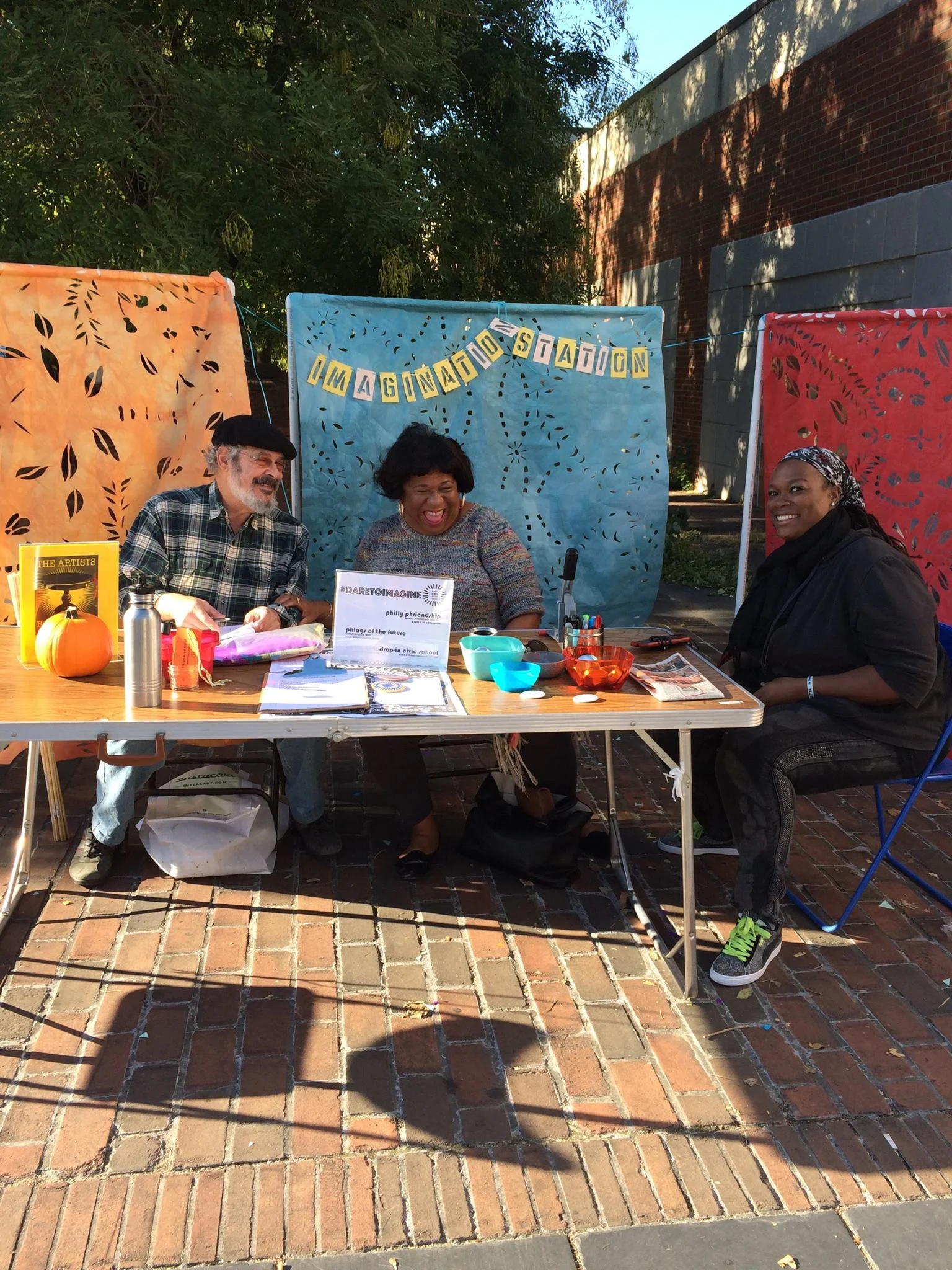 Citizen Artists Lenny Belasco, Juliette Quoquoi and Tieshka Smith hold down the Germantown Imagination Station. (Photo by Yolanda Wisher, October 2016)