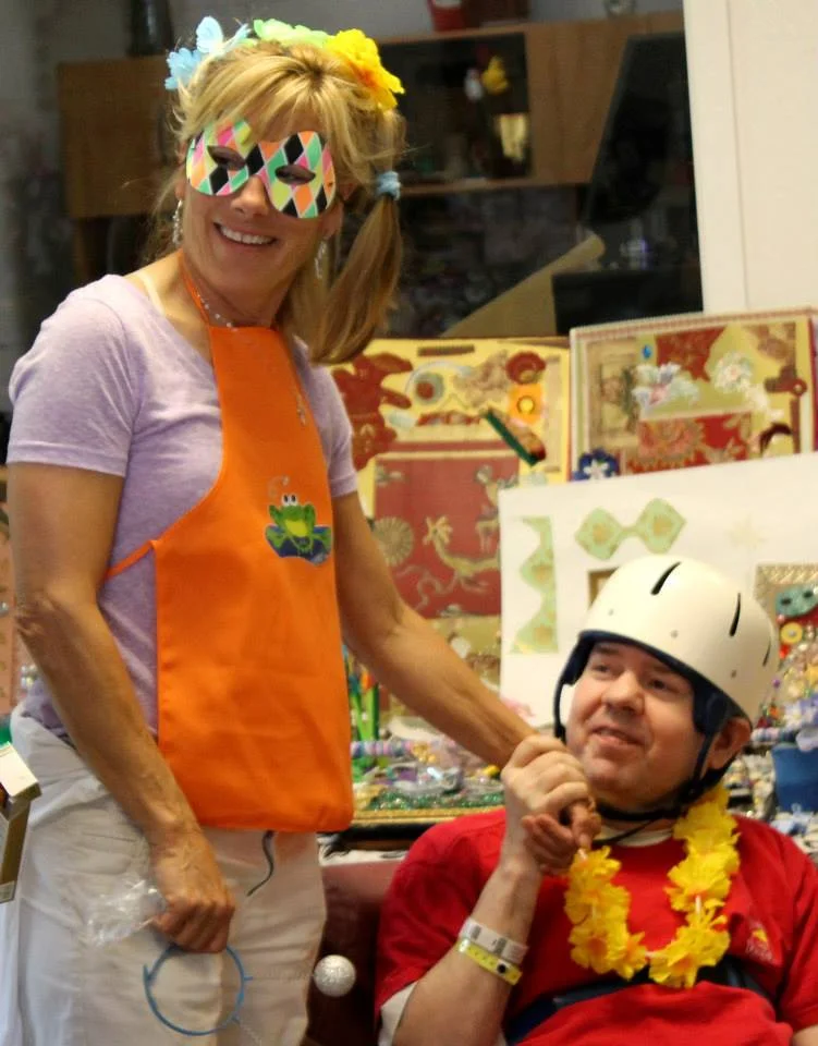 A volunteer visits the Adult Developmental Activities program, bringing cheer into Alan's day with "Wacky Wednesday".