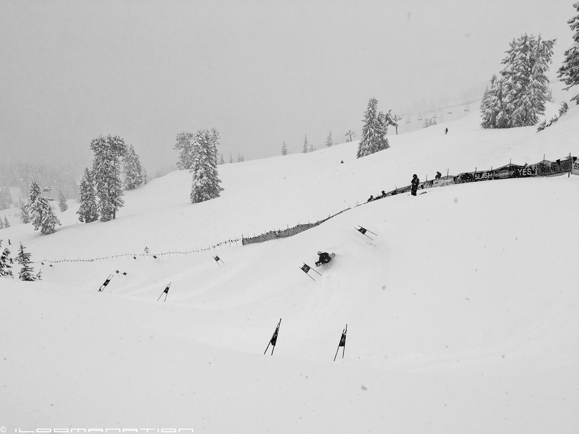 an unidentified rider makes his way through turn 3 of the banked slalom course in "low-viz" conditions.