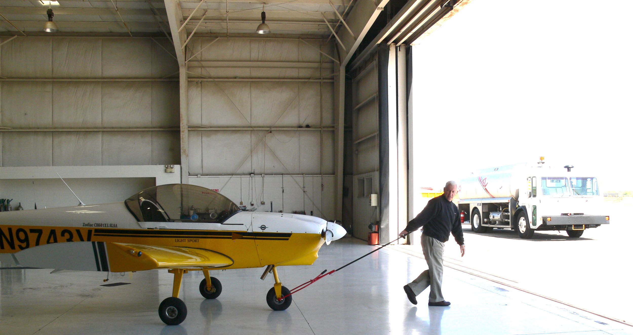  Darrel pulling the lightweight Zodiac plane out for a ride. 