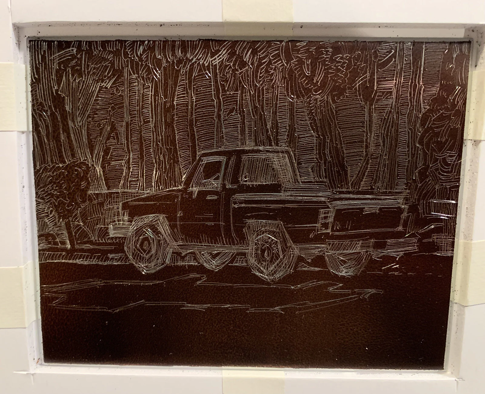 Here’s a shot of the uncompleted drawing on the metal plate. The zinc is covered with a layer of “hardground”, and a metal drawing/scraping implement is used to remove that layer, leaving he exposed zinc below to make essentially a negative of the desired image.