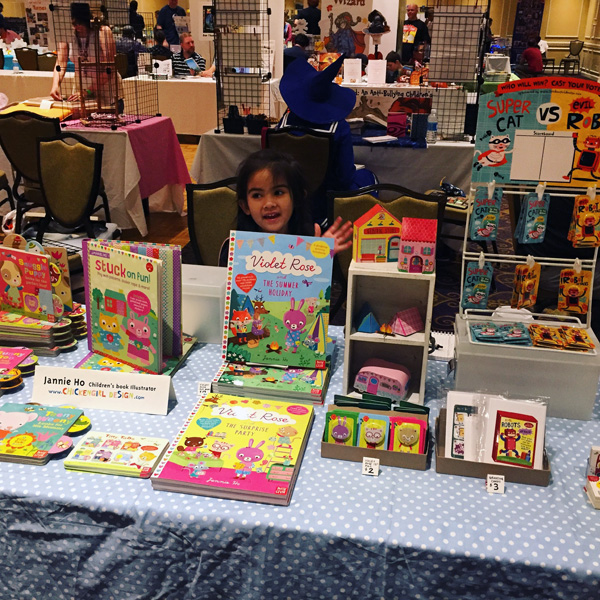 My little helper at my table at KIDS CON New England.