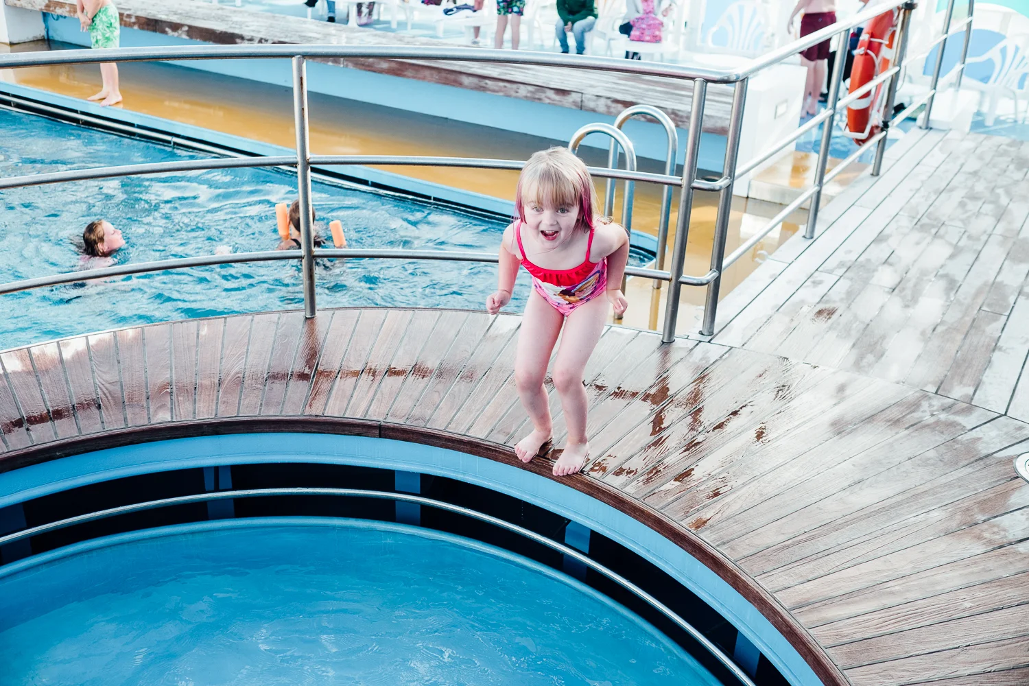 Willow jumping in to the paddling pool, bigger pool behind © Andrew Newson