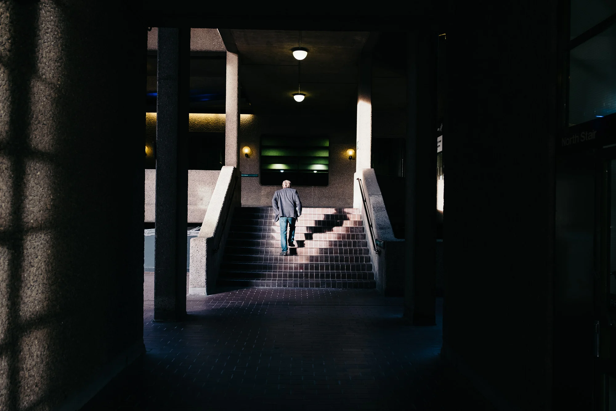 Man on stairs, Barbican Centre © Andrew Newson