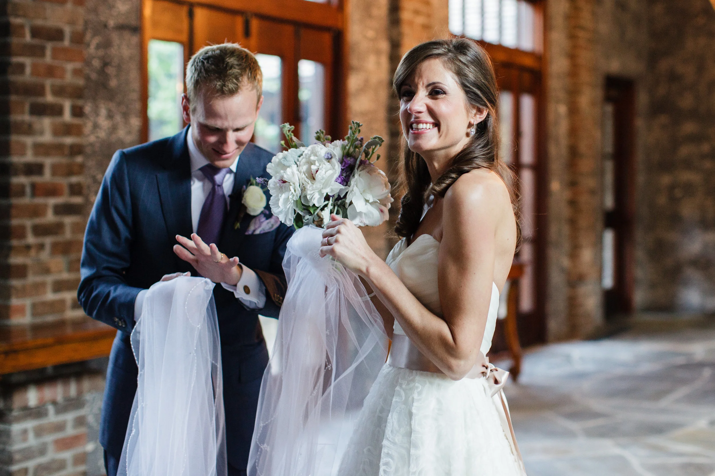 I love this first-married moment right after we walked back down the aisle as husband and wife. I feel like our excitement could just leap off the page! Photo by Sarah DeShaw Photography