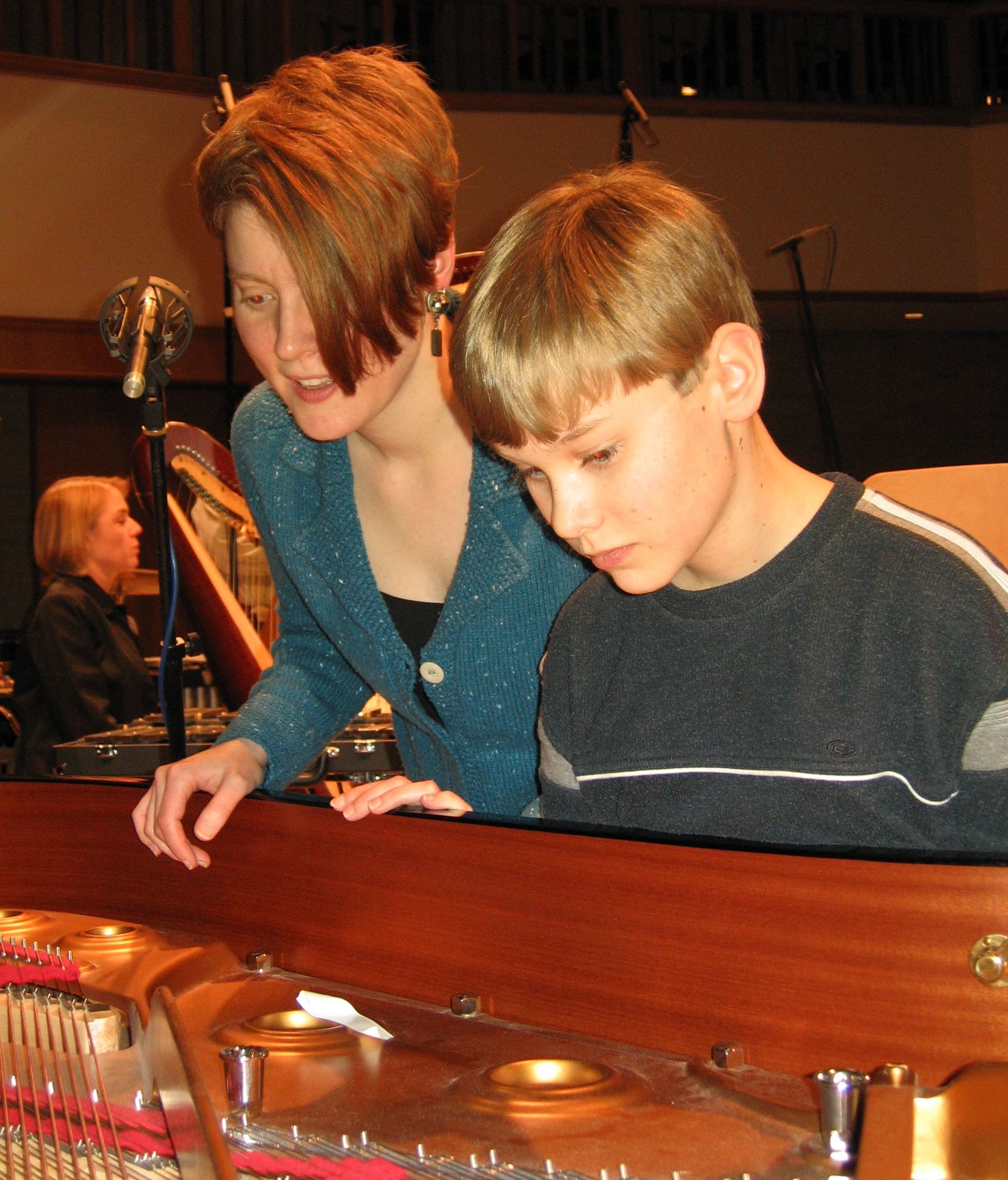  singing into the piano with Justin Murray.  photo: Steve Bruns  
