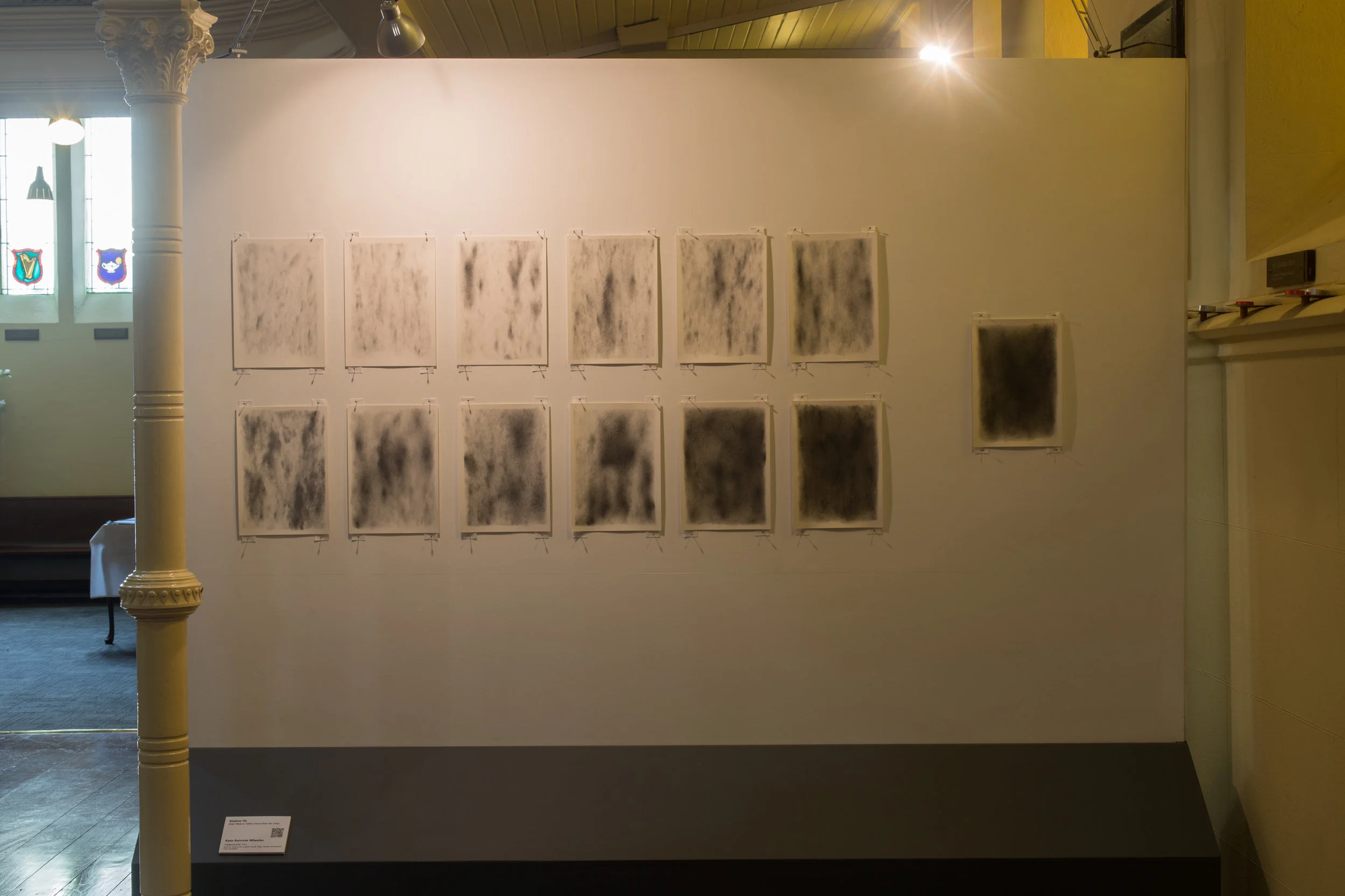 Station 13: Jesus' Body is Taken Down from the Cross Kate Koivisto Wheeler Underworld 016, Pencil, charcoal, paper, body bag, leaves and earth Size variable