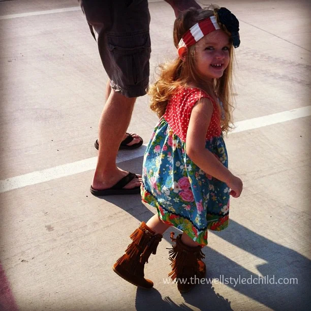 Holiday rocking on her Matilda Jane frocks!