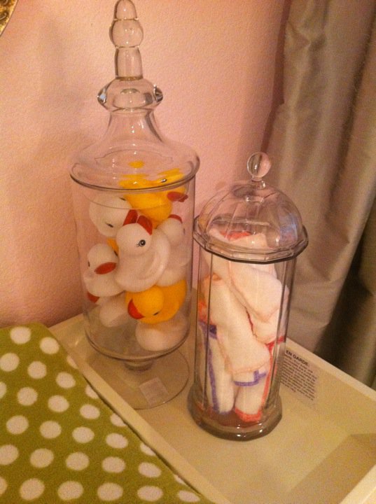 Beautiful glass pieces can work in any room! This rubber ducky filled apothecary jars was one of my most favorite elements in baby Holiday's nursery! The other glass straw container has rolled cloth wipes