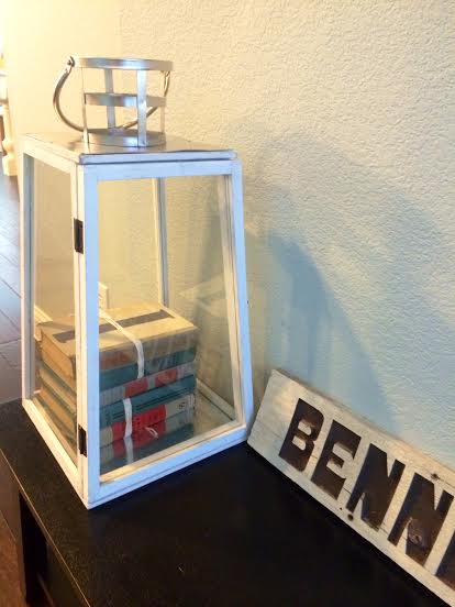 Glass lanterns can also be fantastic, year round decor pieces. I picked this one up at Marshall's for $25 and filled with stacks of books wrapped with twine
