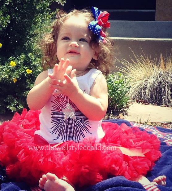 Holiday's first Fourth of July! Just 8 months old! I purchased the tutu at a local children's boutique and then found the sparkly/blingy tank top at Kids-R-Us. These are the days before I really got into boutique fashion, but she still looked super cute and this would be an easy look to replicate on a budget! 