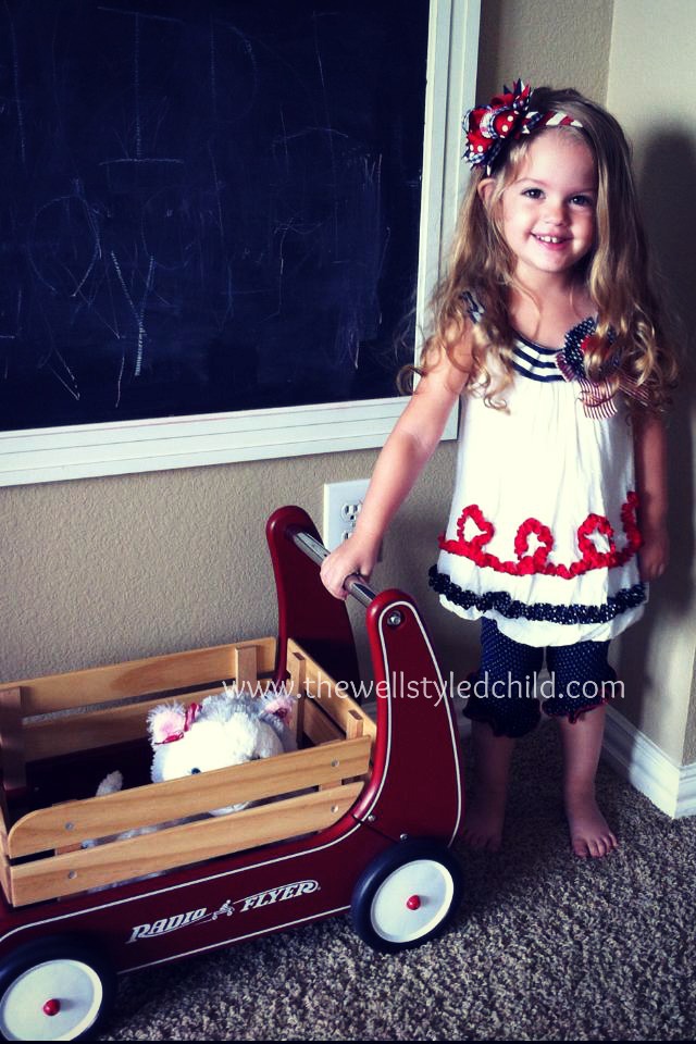 This outfit really has darling details-- you cannot tell in the picture, but the top is all made of eyelit fabric-- really adorable! 