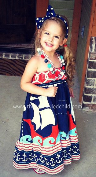 Our first year in this stunning dress from Quinn's Closet. Anyone who follows my blog and page regularly know how much I LOVE this dress!!! I love how she layered the fabrics on the bottom to create the ruffle details and the anchors-- really gorgeous and one of a kind! 