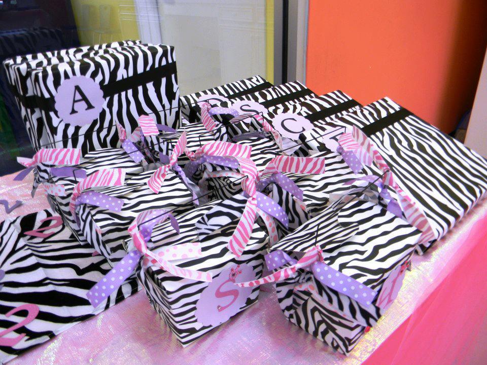 Party favors from Holiday's 2nd Birthday, Gymnastics themed party. I made little initial tags again on the Cricut for each of the children-- and added the layered ribbons to the Chinese take-out boxes. So many cute ways to personalize at next to no cost. 
