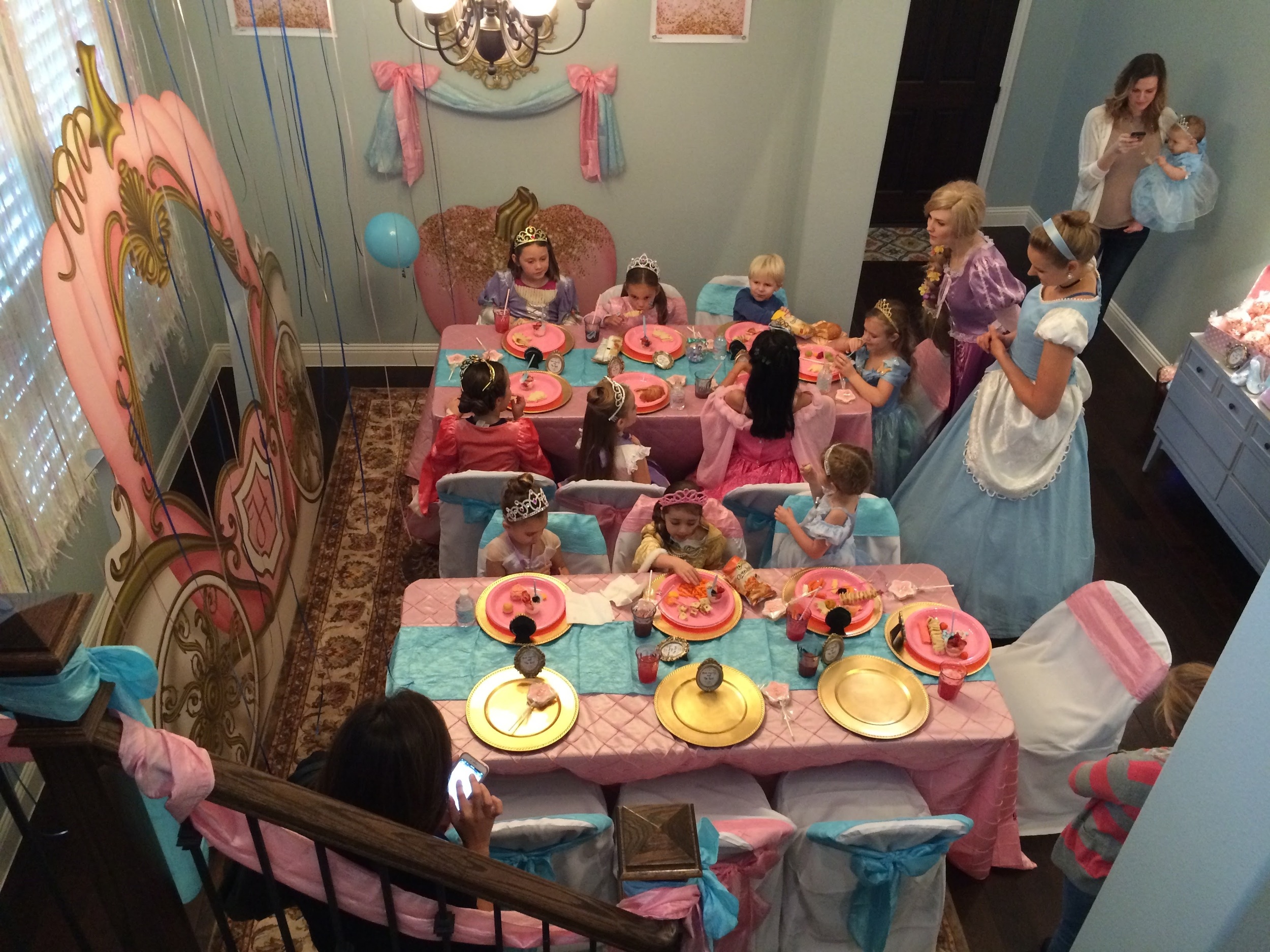 The girls were just starting to get seated for lunch while our Royal Visitors, Princesses Rapunzel and Cinderella entertained them with songs, stories and games. If you're in the Dallas Fort Worth area, I booked these ladies through Royally Fun Parties and they were AMAZING!!!! I cannot say enough good things. They seriously jumped right in and helped with games, crafts, helped the girls get lunch and were like having two extra hostesses at the party. Best of all they had beautiful voices and the girls were SO entertained! It was seriously magical! 