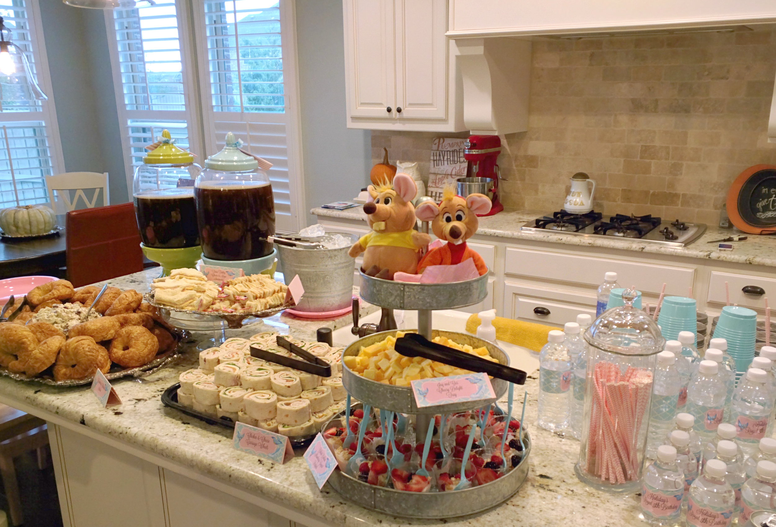 I SO wanted the girls to have their own little buffet set-up in the "Ballroom," but I just couldn't fit it all in there! I kept it pretty simple with Croissants, Sonoma Chicken Salad, Turkey and Cheese Tiara Cut-Out Sandwiches, PB&J Fairy Wand Sandwiches, "Carriage Wheels" Rollups, Jaq and Gus Cheese Tray & Berry Yogurt Parfaits. I gave them all cute, princessy names and made little buffet cards for each.