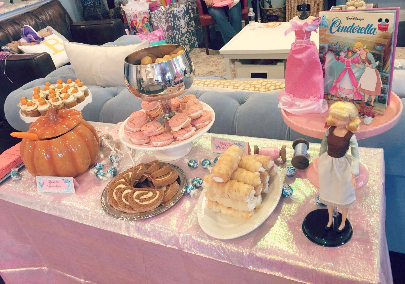 Another little dessert spread in the living room. In retrospect, this whole set-up was probably unnecessary but the Cinderella Trail Mix (inside the pumpkin) was a pretty big hit, as were the cream puffs in the silver bowl!!! 