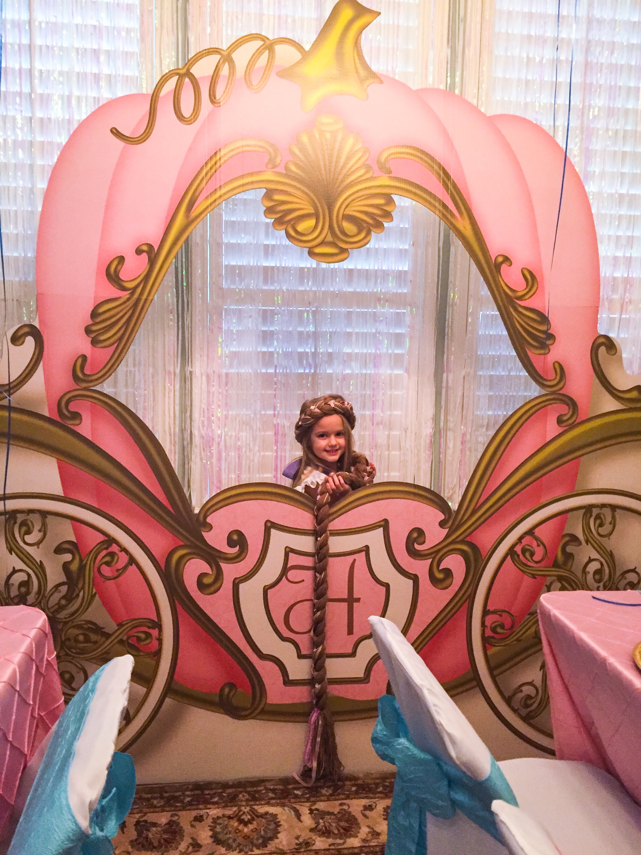 Holiday Rapunzel behind the photo prop carriage! (I need to give a shout-out to my husband (David. I had planned for the carriage being in a different spot, but it ended up being bigger (than my measurements. It was his idea to move it here in the Dining Room and it was definitely (the focal point of the whole party and a huge source of "Wow!") 